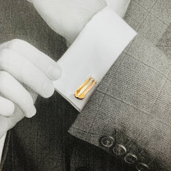 Paire de boutons de manchettes CARTIER "Mini Ressort CC" trois ors. - Castafiore