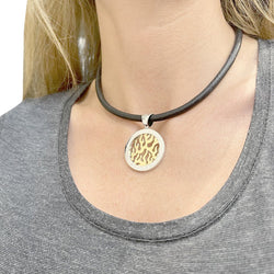 Pendentif Bulgari, "Tondo Fire", acier, or jaune - Castafiore