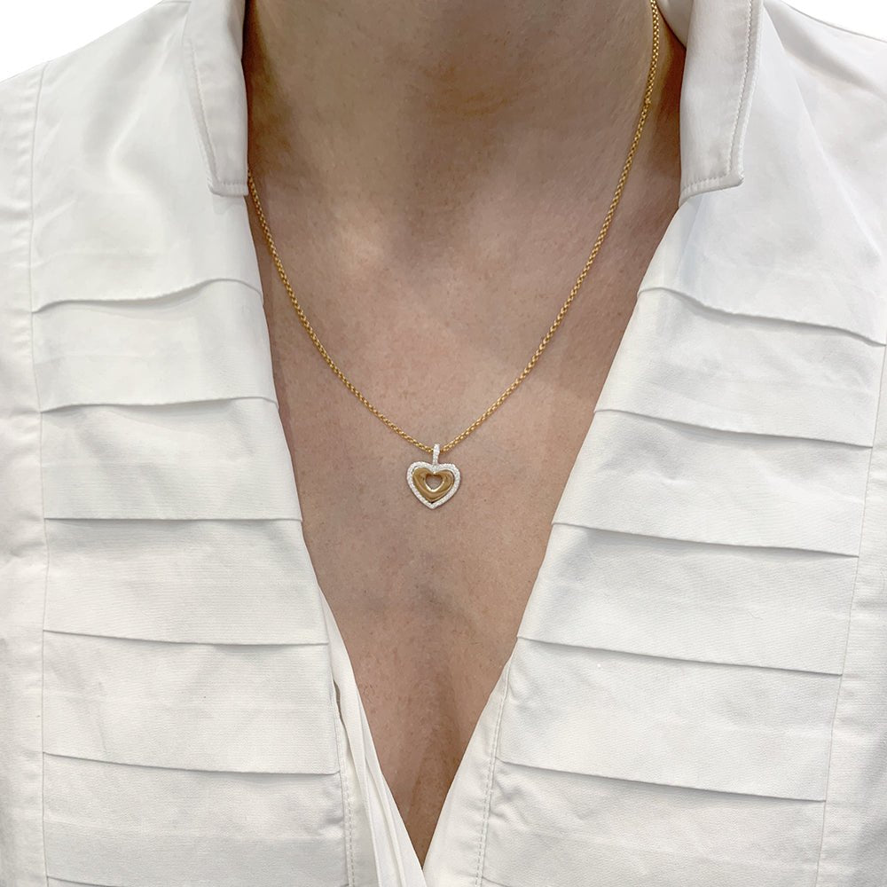 Pendentif Poiray, "Coeur secret", or jaune, or blanc et diamants. - Castafiore