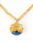 Sautoir en or jaune torsadé formé de bâtonnets et pendentif breloque avec turquoise - Castafiore