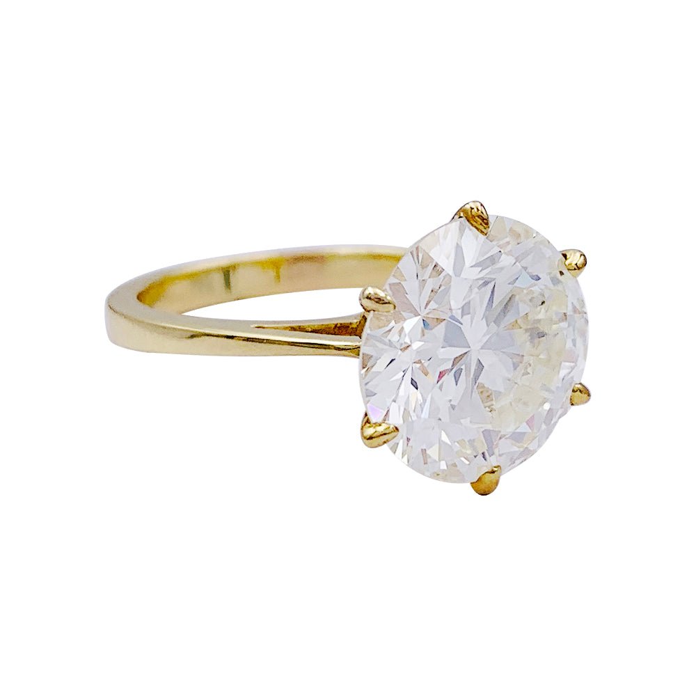 Solitaire en or jaune, diamant 5,77 cts. - Castafiore